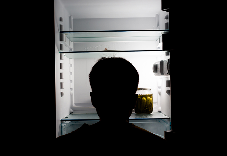 Looking inside of an empty fridge. Silhouette
