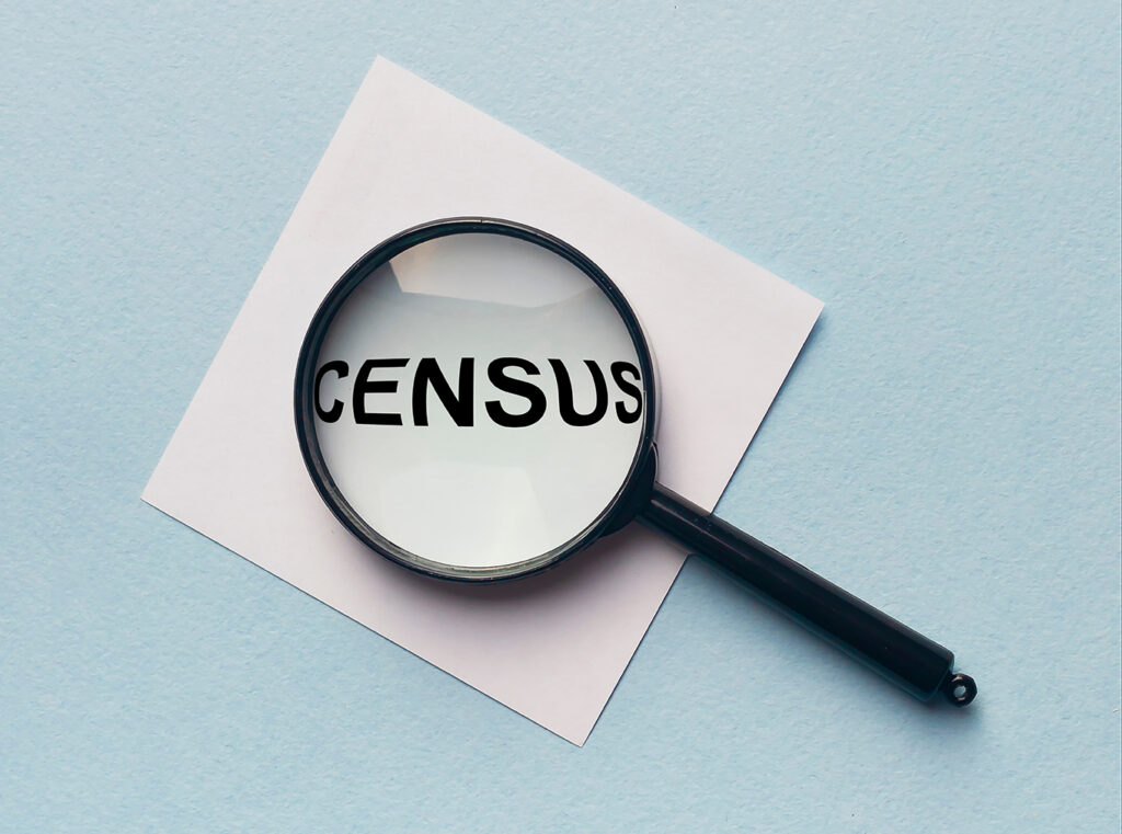 Census word on memo note throught the loupe magnifier