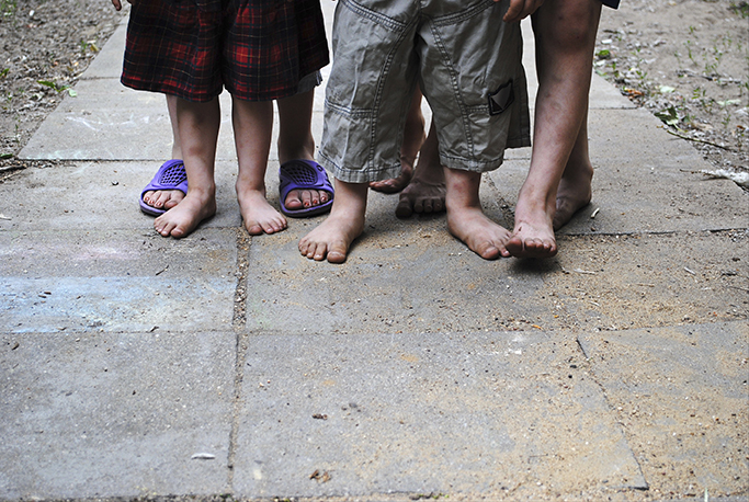 Homeless Children with Bare Feet.