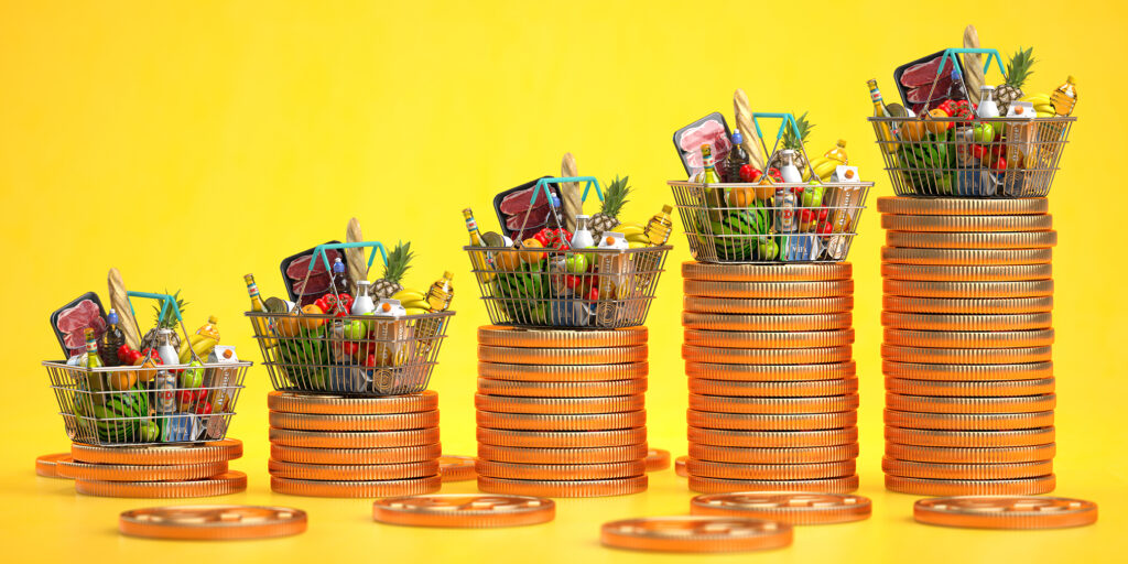 Growth of food sales or growth of market basket or consumer price index concept. Shopping basket with foods with coin stacks on yellow background. 3d illustration