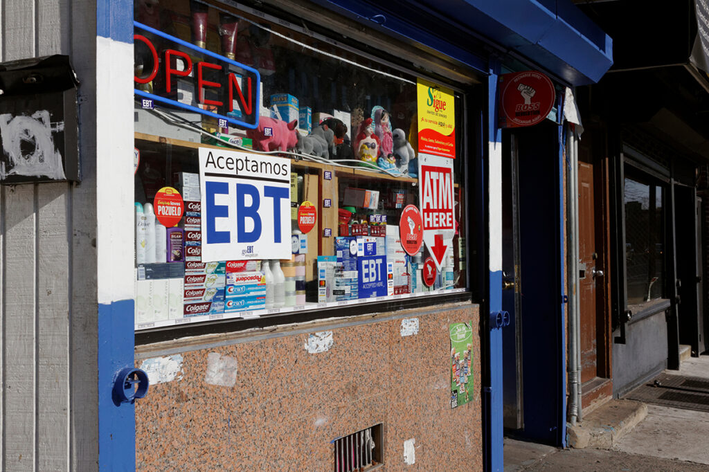 A small independent convenience store advertises that EBT cards, also known as food stamps, are accepted.